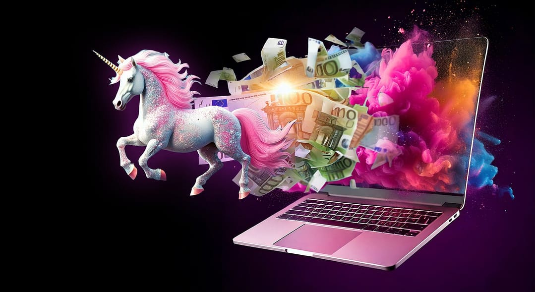 laptop met een exploderende website van geld en eenhoorns